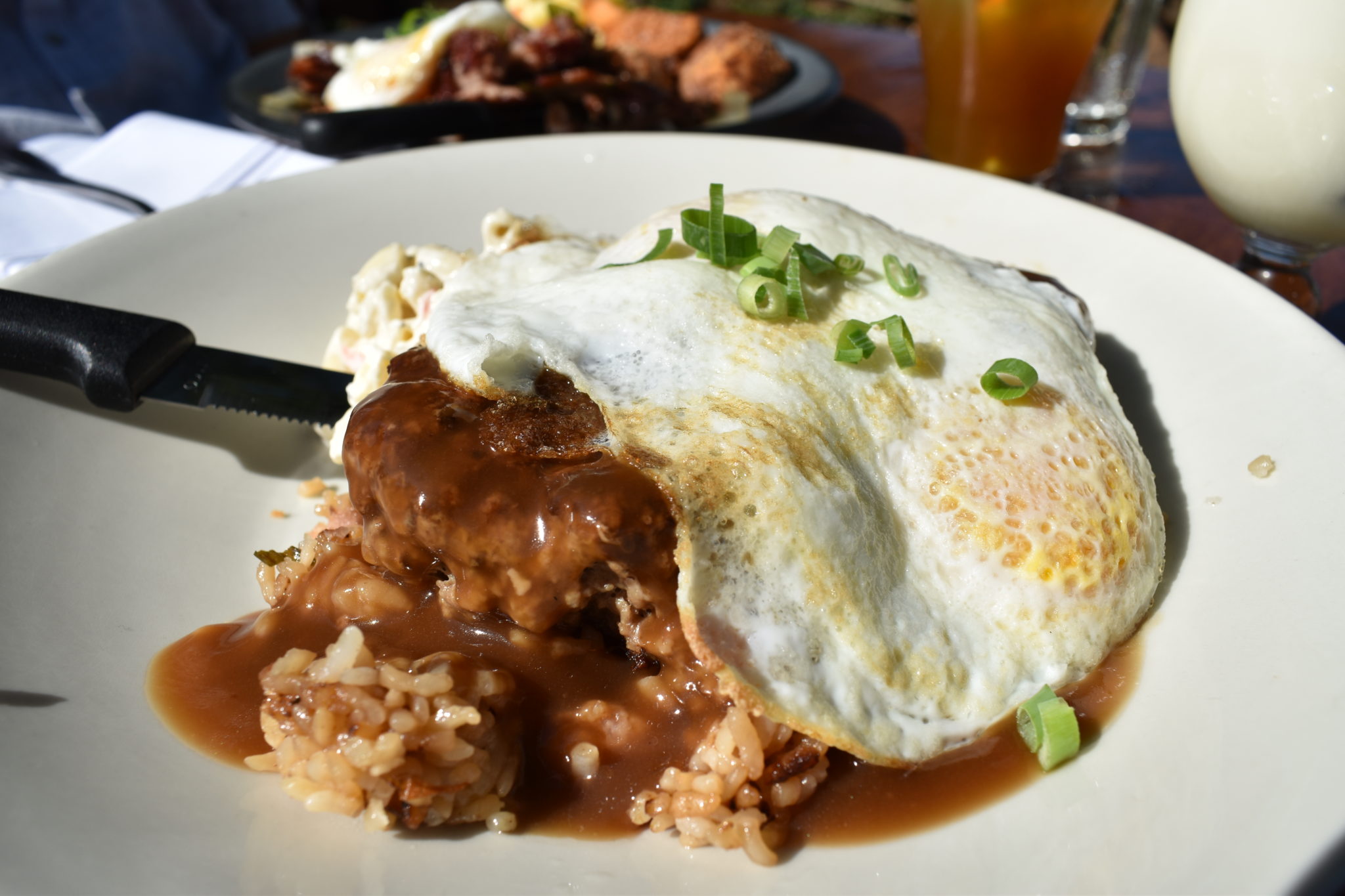 Beef patties on rice, topped with gravy and fried eggs